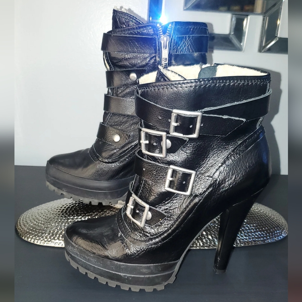 Steve Madden black leather multi buckle ankle boots.